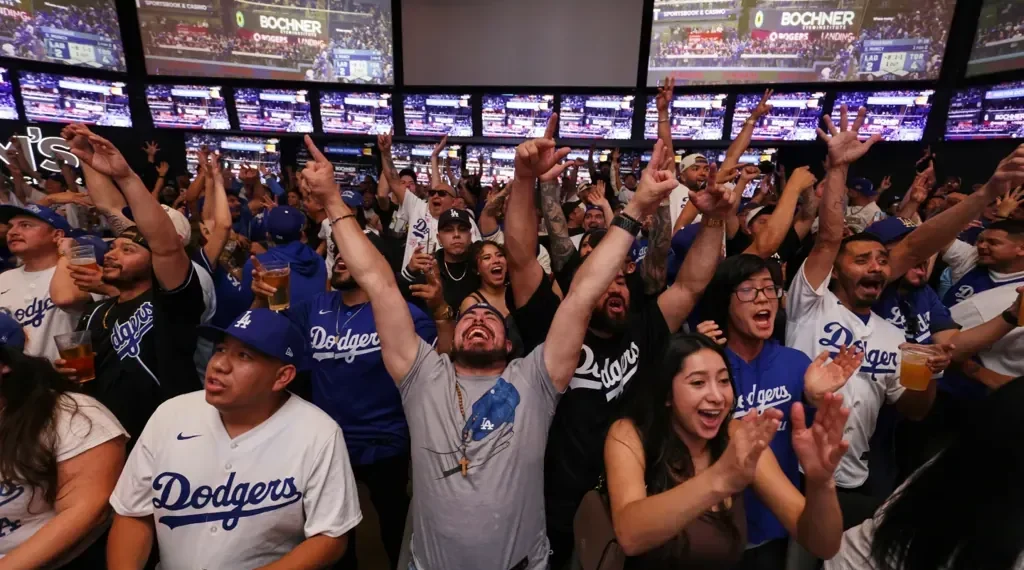 Discover ‘We Mode’: How Group Movement and Cheer Create Shared Joy and Connection - AP Photo/Ethan Swope, File