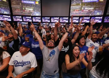 Discover ‘We Mode’: How Group Movement and Cheer Create Shared Joy and Connection - AP Photo/Ethan Swope, File