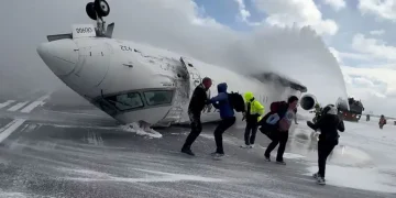 Survivor walks away from overturned Delta plane after Toronto crash - Peter Koukov/Handout/Reuters/CNN