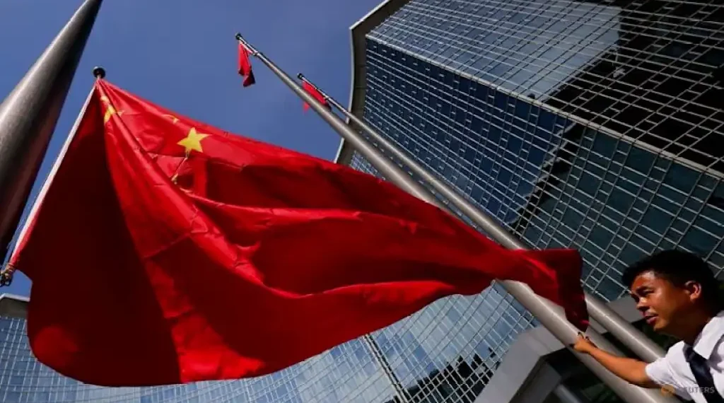 Beijing skyline with Chinese flag representing economic policy planning - Photo: Reuters/Maxim Shemetov/CNA