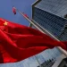 Beijing skyline with Chinese flag representing economic policy planning - Photo: Reuters/Maxim Shemetov/CNA
