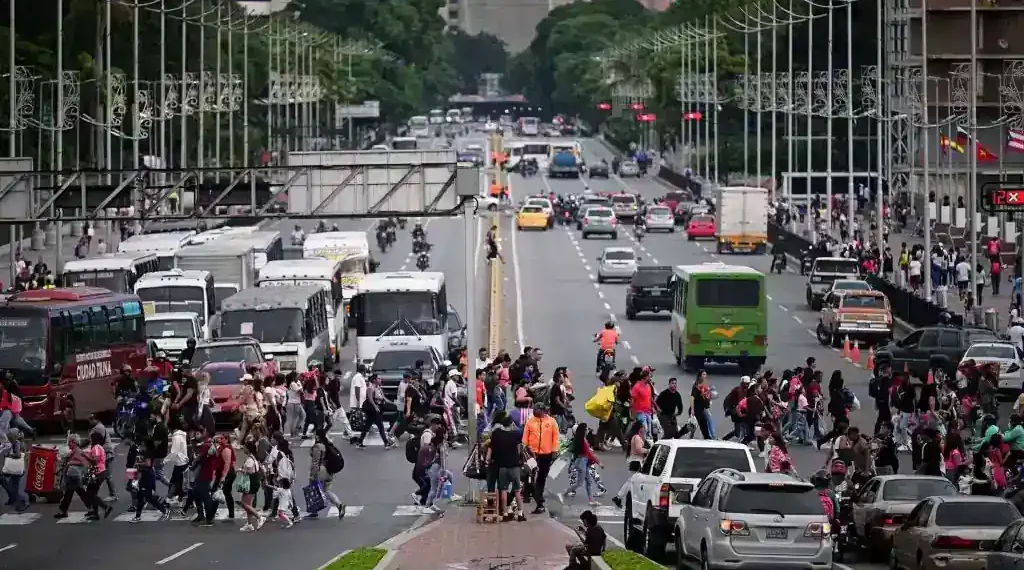Venezuelans walking in Caracas during rising tensions and growing national anxiety - Gaby Oraa/Reuters/CNN