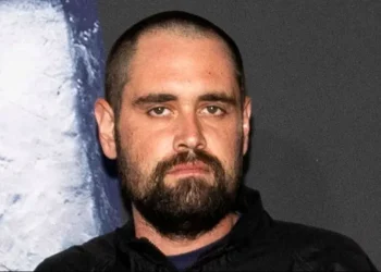 Los Angeles police near the Reiner family residence during investigation. - Aude Guerrucci/Reuters/File