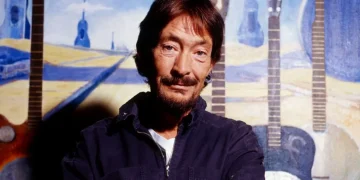 Chris Rea performing on stage during a live concert - Chris Rea pictured in his studio in 2005/Getty Images/BBC