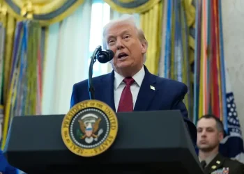 Donald Trump speaking as BBC headquarters appears in background - AP Photo/Alex Brandon