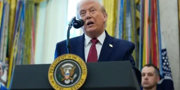 Donald Trump speaking as BBC headquarters appears in background - AP Photo/Alex Brandon