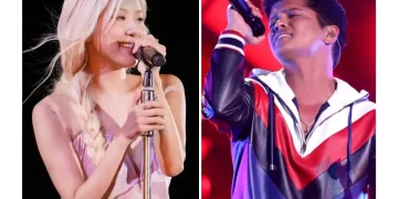 Rosé and Bruno Mars performing “APT.” on stage globally - AP Photo