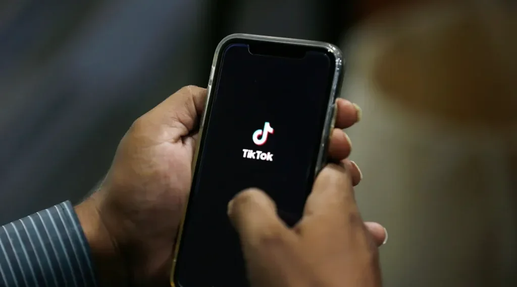TikTok logo with Oracle partnership announcement in U.S. deal - AP Photo/Anjum Naveed, File