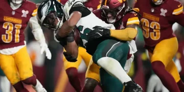 Eagles and Commanders players scuffle after late fourth-quarter play - AP Photo/Stephanie Scarbrough