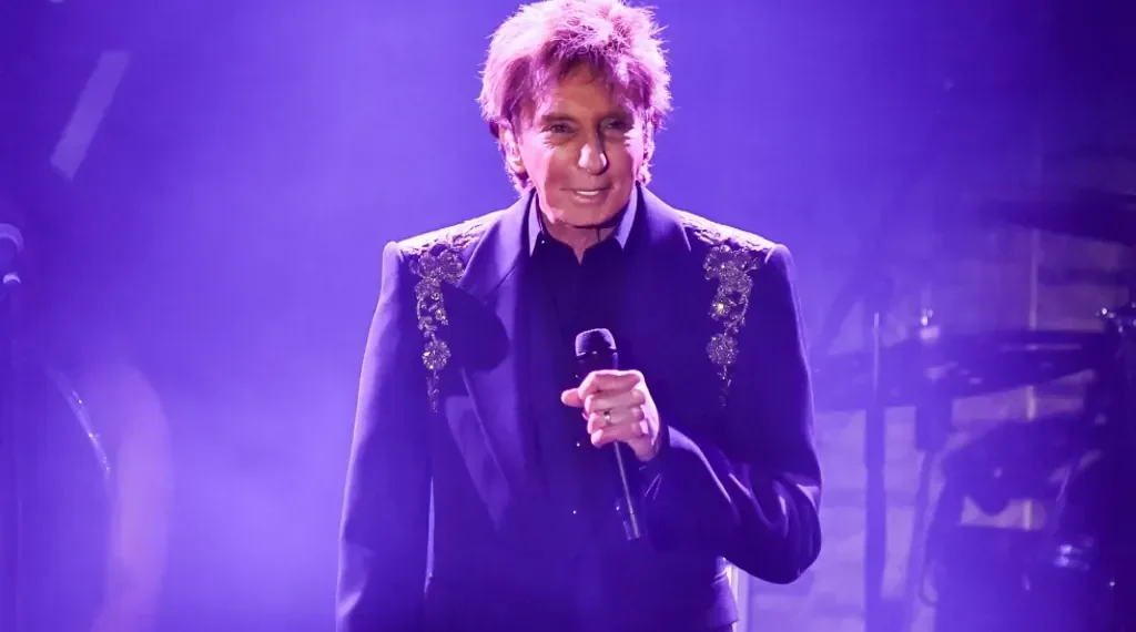 Barry Manilow performing during a recent concert appearance - Photo by Richard Shotwell/Invision/AP, File