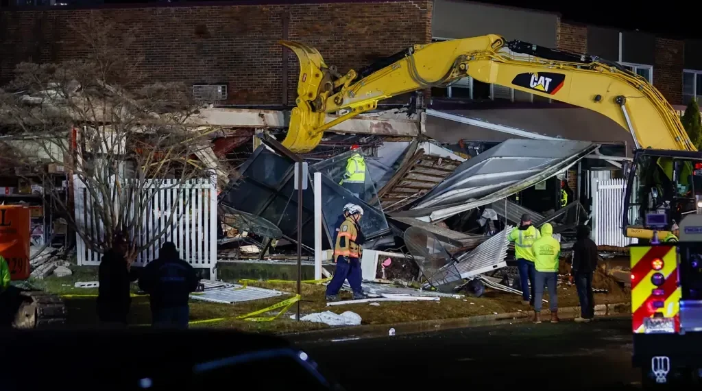 Fire crews at Pennsylvania nursing home explosion site - Monica Herndon/The Philadelphia Inquirer via AP