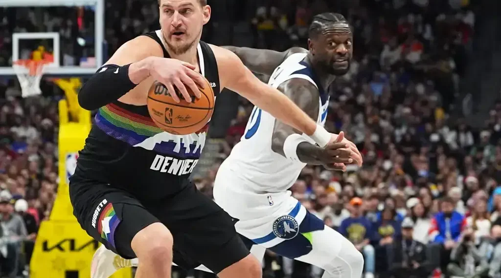 Nikola Jokic celebrates after scoring in overtime against Timberwolves - AP Photo/David Zalubowski