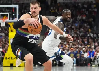Nikola Jokic celebrates after scoring in overtime against Timberwolves - AP Photo/David Zalubowski