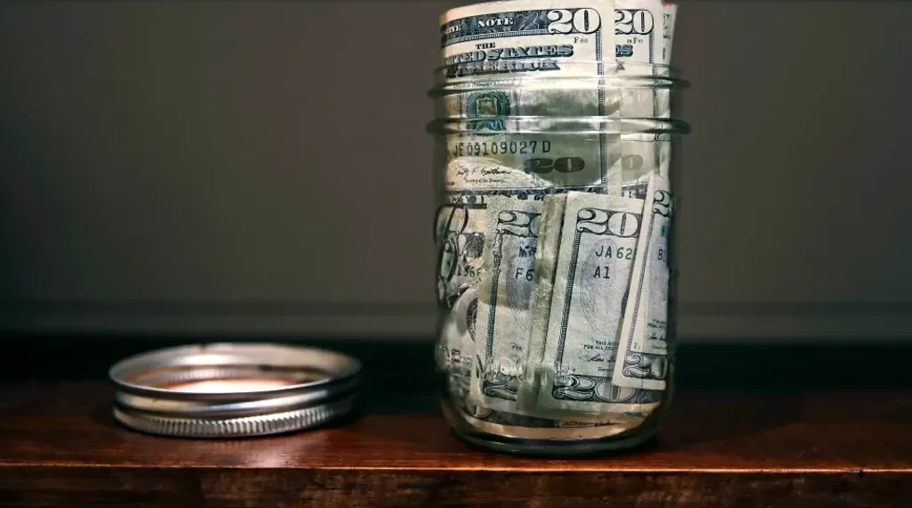 Young adults reviewing budgets and savings plans at home - AP Photo/charles krupa file