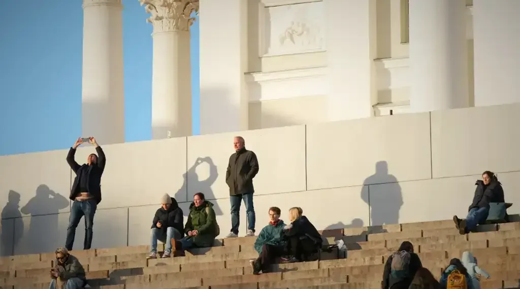Nordic people embracing winter light rituals outdoors - AP Photo/Sergei Grits