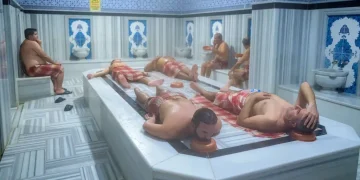 Sunlight filtering through a domed ceiling inside a traditional Turkish bath- Yasin Akgul/AFP/Getty Images/CNN