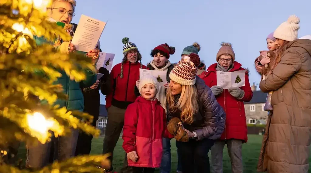 People singing together in a group demonstrating health benefits - Getty Images/BBC