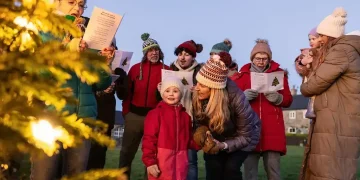 People singing together in a group demonstrating health benefits - Getty Images/BBC