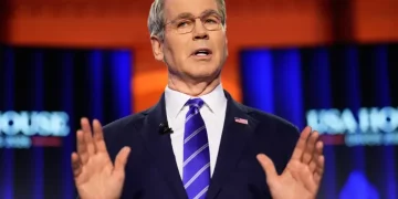 U.S. Treasury Secretary Bessent and Canadian PM Carney discuss trade tensions - AP Photo/Markus Schreiber