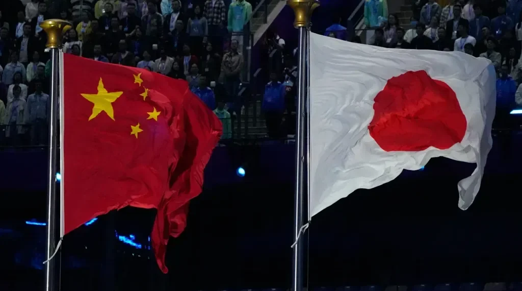 Chinese and Japanese flags amid diplomatic and trade tensions - AP Photo/Eugene Hoshiko, File