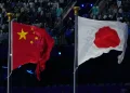 Chinese and Japanese flags amid diplomatic and trade tensions - AP Photo/Eugene Hoshiko, File