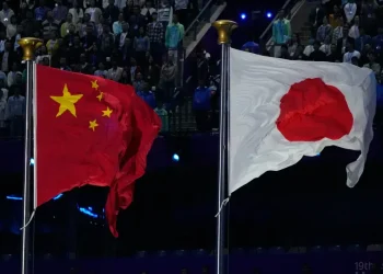 Chinese and Japanese flags amid diplomatic and trade tensions - AP Photo/Eugene Hoshiko, File