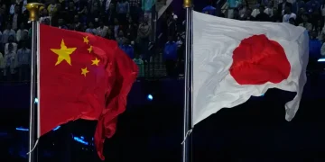 Chinese and Japanese flags amid diplomatic and trade tensions - AP Photo/Eugene Hoshiko, File