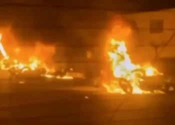 Iranian protesters gather at night amid internet shutdown - Iran state TV via AP