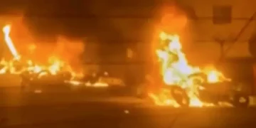 Iranian protesters gather at night amid internet shutdown - Iran state TV via AP