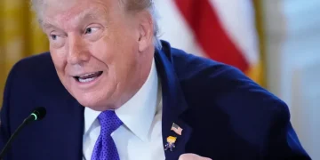 Donald Trump wearing Happy Trump lapel pin at White House event - AP Photo/Alex Brandon