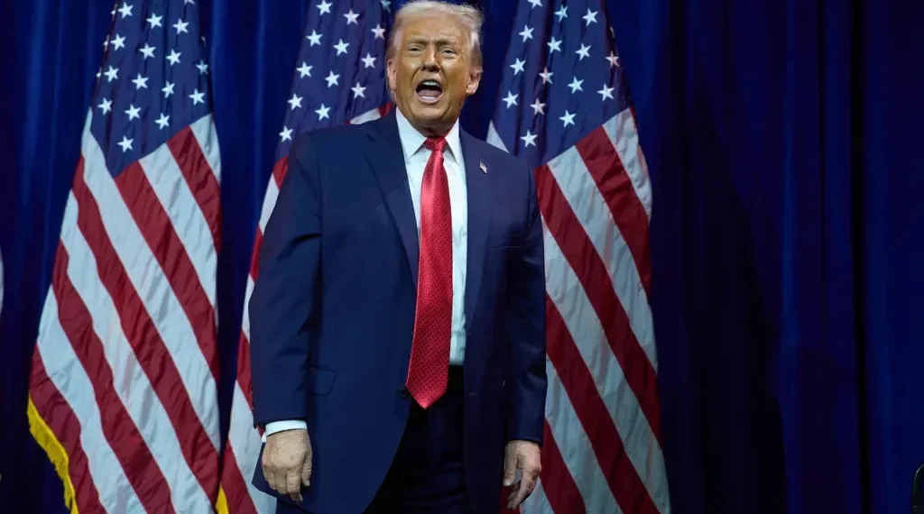 Venezuelan oil barrels with U.S. and Venezuela flags - AP Photo/Evan Vucci