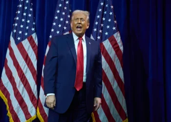 Venezuelan oil barrels with U.S. and Venezuela flags - AP Photo/Evan Vucci