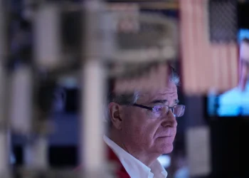 Wall Street traders as U.S. stocks reach record highs - AP Photo/Seth Wenig