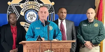 Law enforcement vehicles at rural Mississippi shooting investigation scene - William Moore/Northeast Mississippi Daily Journal via AP