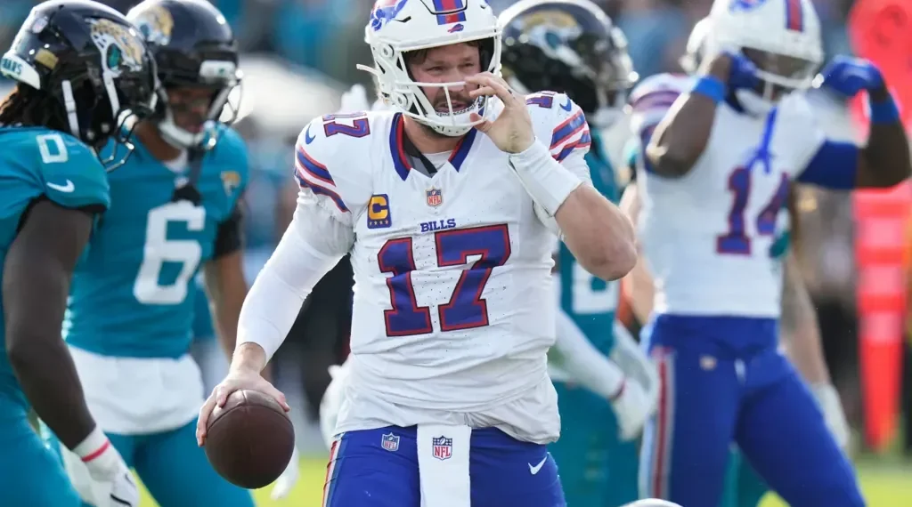 Josh Allen celebrates historic Bills road playoff win - AP Photo/Chris O'Meara