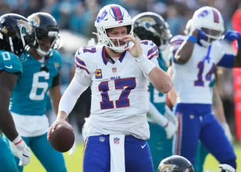 Josh Allen celebrates historic Bills road playoff win - AP Photo/Chris O'Meara