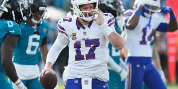 Josh Allen celebrates historic Bills road playoff win - AP Photo/Chris O'Meara