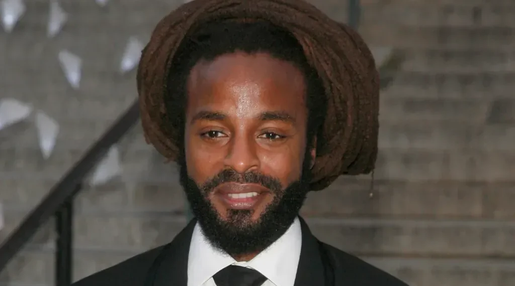 John Forté performing on stage during a live concert - Photo by Andy Kropa/Invasion/AP, File