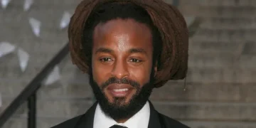 John Forté performing on stage during a live concert - Photo by Andy Kropa/Invasion/AP, File