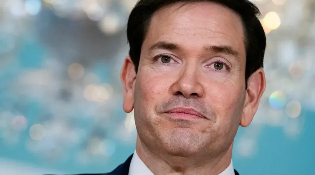 US embassy visa processing sign at consular office entrance - AP Photo/Cliff Owen