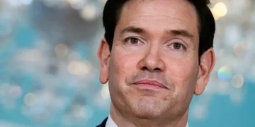 US embassy visa processing sign at consular office entrance - AP Photo/Cliff Owen