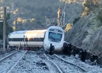Overturned high-speed train carriages after collision in Spain - Guardia Civil via AP