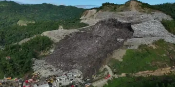 Rescuers search debris after Philippine landfill collapse in Cebu City - AP Photo/Jaqueline Hernandez