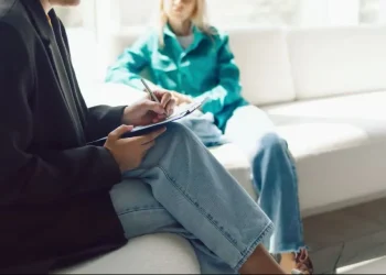 Diagnostic manual psychiatry book representing mental health classification - Olga Pankova/Moment RF/Getty Images