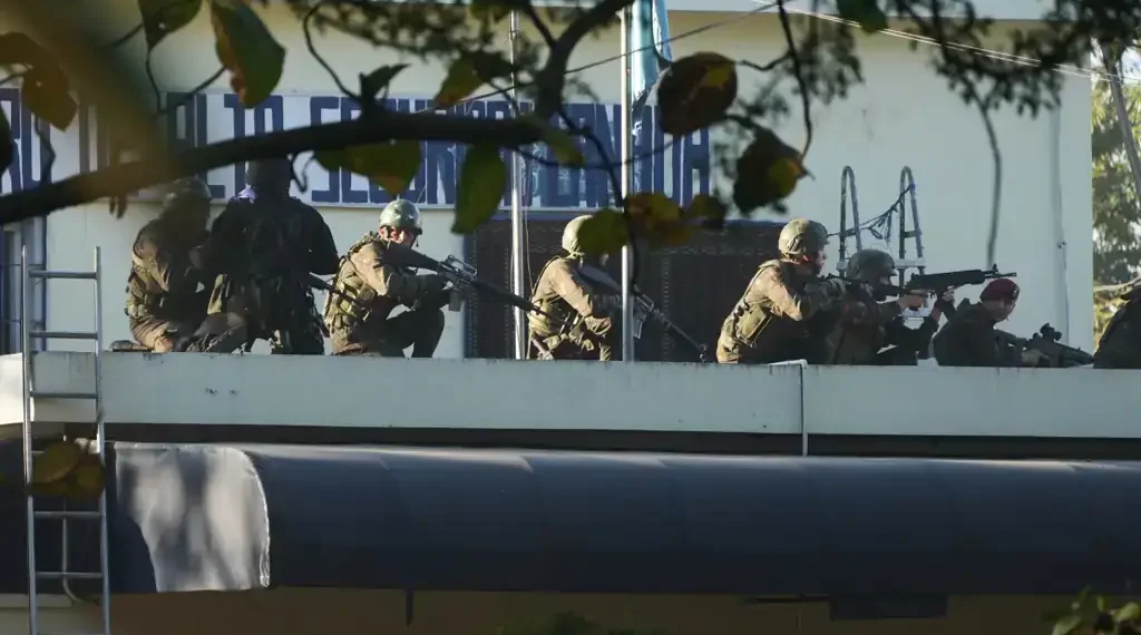 Guatemalan police secure area after deadly gang attacks - AP Photo/Moises Castillo