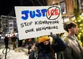 Protesters gather in Portland against ICE enforcement actions in Maine - AP Photo/Robert F. Bukaty