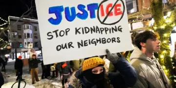 Protesters gather in Portland against ICE enforcement actions in Maine - AP Photo/Robert F. Bukaty