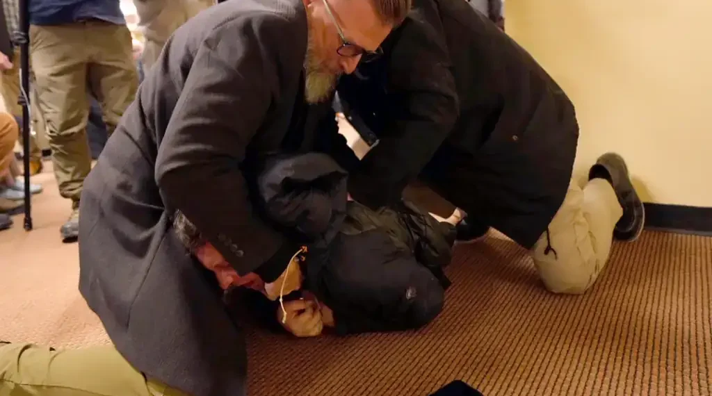 Ilhan Omar speaking at Minneapolis town hall after disruption - Richard Tsong-Taatarii/Star Tribune via AP