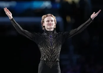 Ilia Malinin performing quad jump during elite figure skating competition - AP Photo/Stephanie Scarbrough