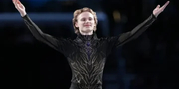 Ilia Malinin performing quad jump during elite figure skating competition - AP Photo/Stephanie Scarbrough